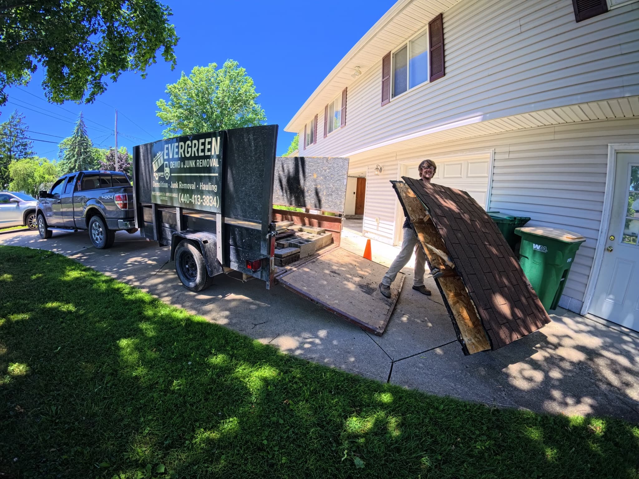 Evergreen junk removal truck and trailer at residential job Ohio